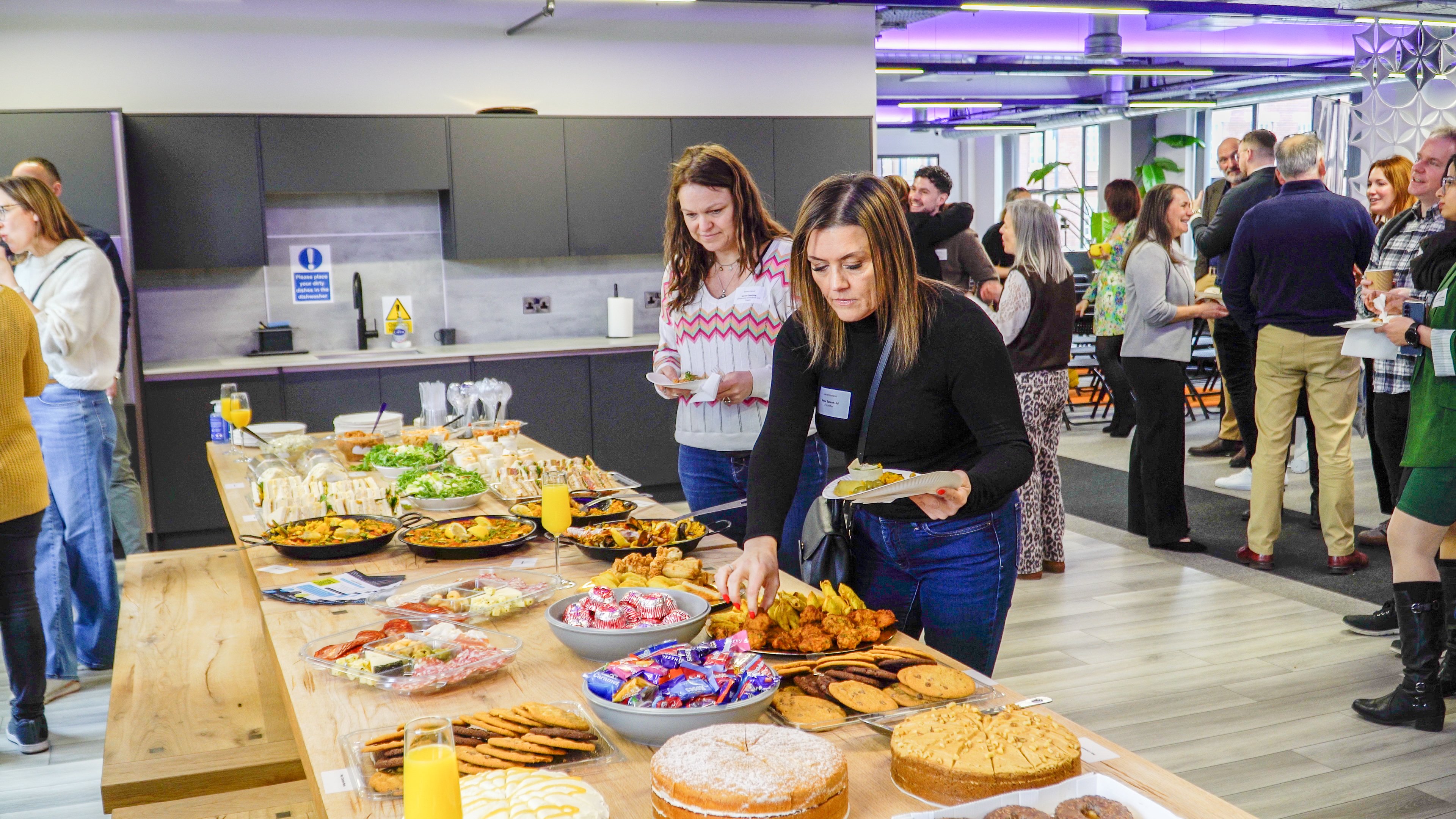 People eating from a buffet