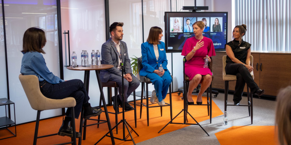 A panel of four people being led by one woman 
