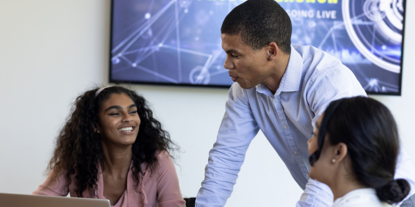 Three people discussing AI