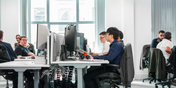 People sat working in an office on computers