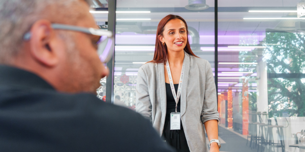 Woman smiling stood in an office