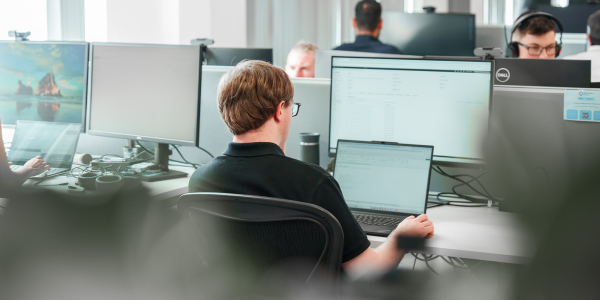 Man sat working at a computer desk