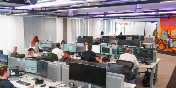 An office full of people working at computers