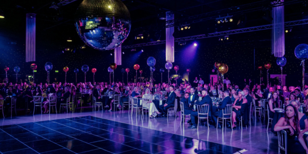 People sat at tables at the YCCA event
